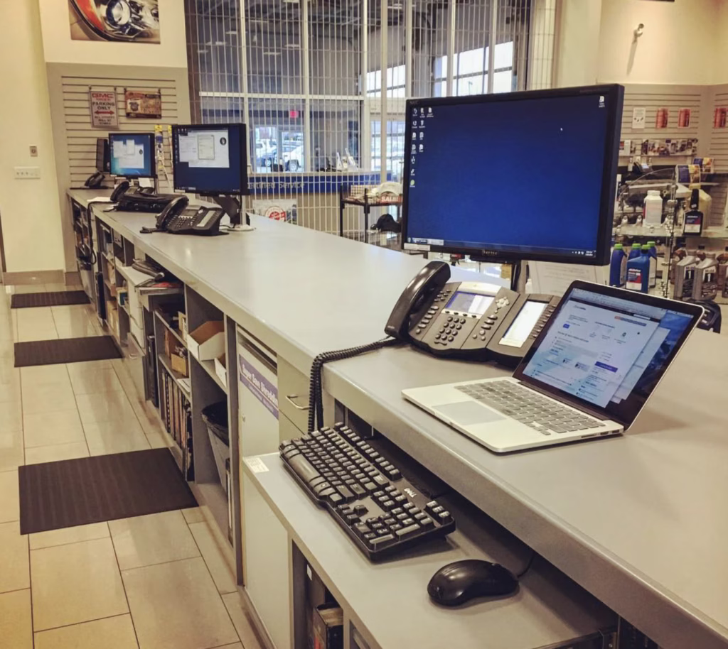 Setting up computers in the parts department at Preston GM in Langley, BC.